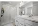 Bathroom with double sinks, shower, and updated fixtures at 28330 E 6Th Pl, Watkins, CO 80137