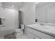 Clean bathroom with shower-tub combination and a vanity with ample counter space and large mirror at 28330 E 6Th Pl, Watkins, CO 80137