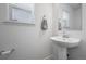 Bright bathroom with a vessel sink, large mirror, and neutral color palette at 28330 E 6Th Pl, Watkins, CO 80137