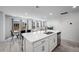 Open concept kitchen and dining area with an island, flowing into the living room, perfect for entertaining at 28330 E 6Th Pl, Watkins, CO 80137