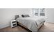 Bedroom featuring a queen sized bed and large window with natural light at 28330 E 6Th Pl, Watkins, CO 80137