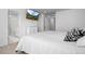 Bright main bedroom with recessed lighting and television; bathroom located through doorway at 28330 E 6Th Pl, Watkins, CO 80137