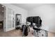 Bright home office featuring a glass desk and shelving with lots of natural light at 28330 E 6Th Pl, Watkins, CO 80137