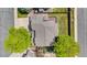 Aerial shot of the property highlighting roof, large backyard, wooden deck, and mature trees at 3418 Elk Ct, Broomfield, CO 80020