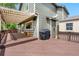 Back deck featuring a pergola, BBQ grill, and a storage shed; a great outdoor entertaining space at 3418 Elk Ct, Broomfield, CO 80020