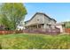 Large fenced backyard with a spacious deck and a covered pergola at 3418 Elk Ct, Broomfield, CO 80020