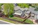 Aerial view of the home's fenced backyard with a well-maintained lawn, shed, and a spacious wood deck at 3418 Elk Ct, Broomfield, CO 80020