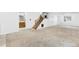 Finished basement featuring carpet, a staircase, and extra storage spaces at 3418 Elk Ct, Broomfield, CO 80020