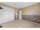 A finished basement boasts a stylish accent wall and ample storage in a neutral color palette at 3418 Elk Ct, Broomfield, CO 80020