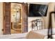This bathroom features a glass enclosed shower and sliding wood door at 3418 Elk Ct, Broomfield, CO 80020