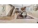 Open floor plan featuring a formal dining room connecting to a kitchen with a stone island at 3418 Elk Ct, Broomfield, CO 80020
