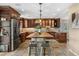 Spacious kitchen features a large center island with stone accents, perfect for gathering and entertaining at 3418 Elk Ct, Broomfield, CO 80020