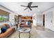 This living room has great natural light, access to the kitchen, and beautiful leather furniture at 3418 Elk Ct, Broomfield, CO 80020