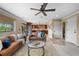 Open concept living room and kitchen with hardwood floors and natural light at 3418 Elk Ct, Broomfield, CO 80020