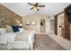 Main bedroom with closet and bathroom access, with a neutral color palette at 3418 Elk Ct, Broomfield, CO 80020