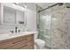 Modern bathroom featuring a sleek glass shower, contemporary vanity, and stylish fixtures for a spa-like experience at 9519 W Coal Mine Ave # F, Littleton, CO 80123