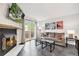Cozy living room features a fireplace, sliding doors to a deck, and a modern design at 9519 W Coal Mine Ave # F, Littleton, CO 80123