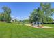 Community playground with swings and a slide, providing a fun and safe space for children to play at 9519 W Coal Mine Ave # F, Littleton, CO 80123