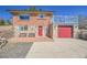 Exterior view of a two-story brick home featuring a spacious terrace above the garage and stone accents at 1460 Russell St, Golden, CO 80401