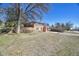 A beautiful exterior view of this home shows the lovely brick and yard at 1460 Russell St, Golden, CO 80401