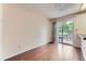 Open floorplan dining room featuring wood floors and sliding glass door at 4130 E 94Th Ave # B, Thornton, CO 80229
