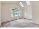 Bright main bedroom with vaulted ceilings, multiple windows, and plush carpet at 4130 E 94Th Ave # B, Thornton, CO 80229