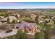 Expansive aerial view of the home nestled within a lush landscape with mountain views at 4605 Tierra Alta Dr, Castle Rock, CO 80104
