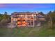 Expansive backyard showcasing a luxurious home with multiple decks, patios and stone work at 4605 Tierra Alta Dr, Castle Rock, CO 80104