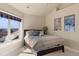 Comfortable bedroom features a large window, ceiling fan, and neutral color scheme at 4605 Tierra Alta Dr, Castle Rock, CO 80104