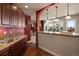 Kitchenette has granite counters, bar seating, wood cabinets and is part of an open-concept entertaining space at 4605 Tierra Alta Dr, Castle Rock, CO 80104