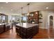Large kitchen featuring an island, fireplace, stainless steel appliances and plenty of natural light at 4605 Tierra Alta Dr, Castle Rock, CO 80104