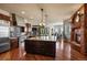 Gourmet kitchen featuring an island, hardwood floors, stainless steel appliances and fireplace at 4605 Tierra Alta Dr, Castle Rock, CO 80104