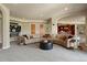 Open-concept living room featuring plush seating, a bar area, and neutral decor at 4605 Tierra Alta Dr, Castle Rock, CO 80104