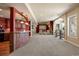 Entertaining area featuring home theater, bar area, carpeted floors, and neutral color scheme at 4605 Tierra Alta Dr, Castle Rock, CO 80104