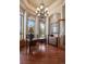 Bright office featuring a stylish desk, large arched windows, and a decorative chandelier at 4605 Tierra Alta Dr, Castle Rock, CO 80104
