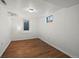 Finished basement offers flexible space with modern vinyl floors and bright, neutral paint at 5008 Sherman St, Denver, CO 80216