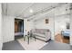 Finished basement with a gray sofa and white walls, offering a cozy and versatile living space at 5008 Sherman St, Denver, CO 80216