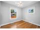 Bright bedroom offering hardwood floors and natural light, creating a warm and inviting atmosphere at 5008 Sherman St, Denver, CO 80216