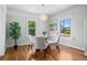 Charming dining room featuring a glass table and modern lighting fixture at 5008 Sherman St, Denver, CO 80216