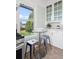 Charming kitchen nook with a glass table, offering views of the outdoors at 5008 Sherman St, Denver, CO 80216