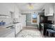 Bright kitchen featuring stainless steel appliances and ample counter space at 5008 Sherman St, Denver, CO 80216