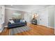 Bright living room with hardwood floors, stylish decor, and ample natural light at 5008 Sherman St, Denver, CO 80216