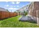Relaxing covered patio, perfect for outdoor dining and entertaining with lush, grassy surroundings at 5008 Sherman St, Denver, CO 80216