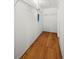 Spacious walk-in closet with ample shelving and hardwood floors, perfect for organized storage at 5008 Sherman St, Denver, CO 80216