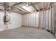 Unfinished basement area featuring exposed framing, concrete flooring, and essential plumbing installations at 2248 Rosette Ln, Castle Rock, CO 80104