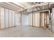 Partially finished basement showcasing both unfinished utility elements and framed areas for future customization at 2248 Rosette Ln, Castle Rock, CO 80104