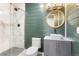 Modern bathroom with marble shower, stylish vanity, vessel sink, and updated fixtures at 2248 Rosette Ln, Castle Rock, CO 80104