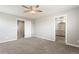 Spacious bedroom with plush carpet and access to the bathroom at 2248 Rosette Ln, Castle Rock, CO 80104