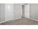 A spare bedroom is freshly carpeted with neutral decor, providing a blank slate to make it your own at 2248 Rosette Ln, Castle Rock, CO 80104