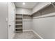 Walk-in closet featuring shelves and a hanging rod for storage at 2248 Rosette Ln, Castle Rock, CO 80104